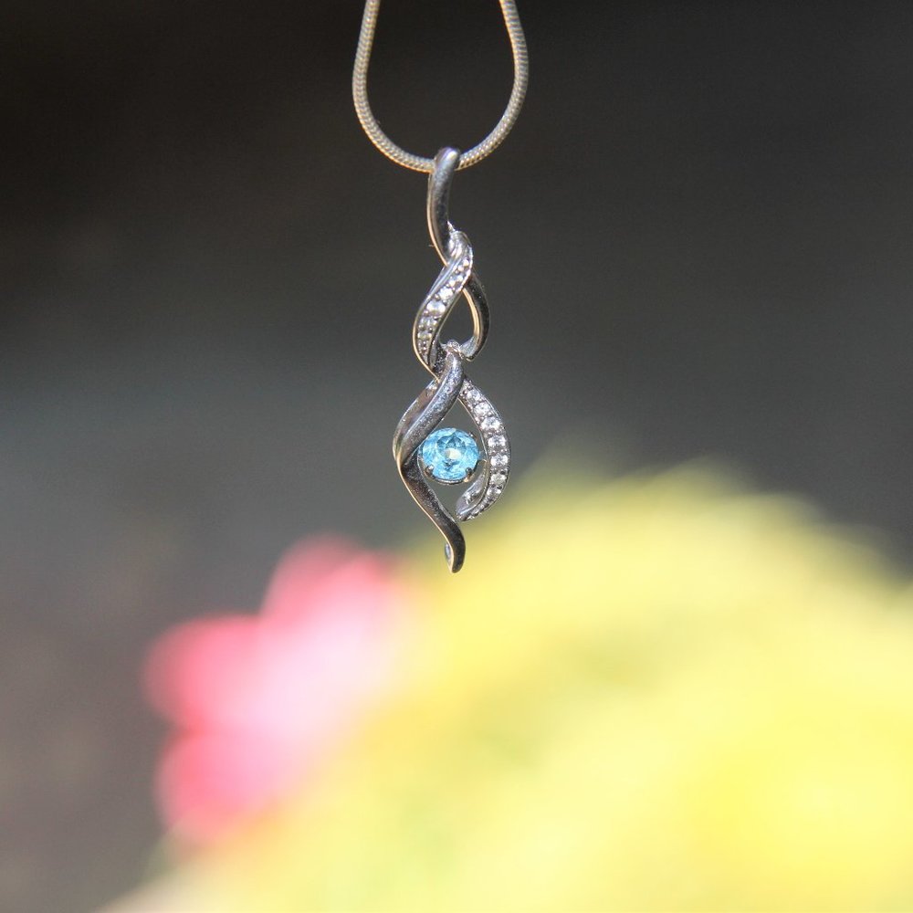 Sterling Silver Infinity Floating Topaz Necklace